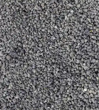 Grey crushed stone close up, the layer a roller compacts